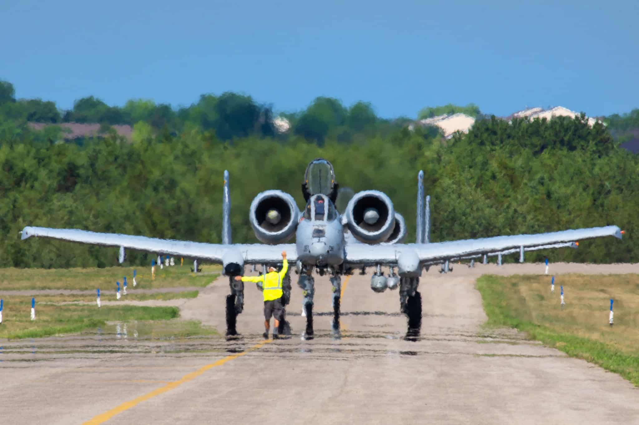 Wings of the North volunteer ushers two A-10s onto the ramp during AirExpo21.