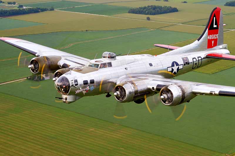 Yankee Air Museum\'s B-17 Yankee Lady taking flight over farm fields