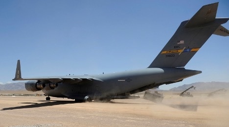 A C-17 performs a combat off-load of pallets in Afghanistan, June 2009.